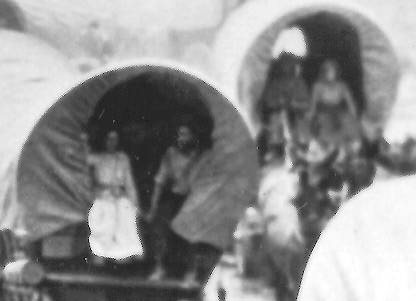 People in wagons at right.