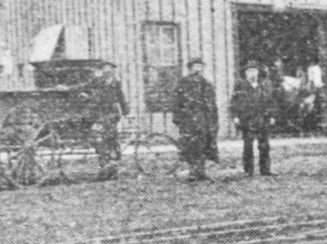 Men stand at left