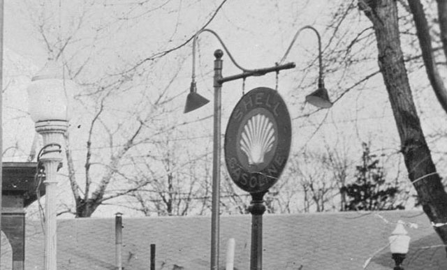 Detail of Shell Gasoline sign and street lights