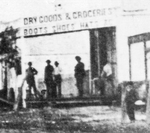 Detail of "DRY GOODS & GROCERIES" on Right
