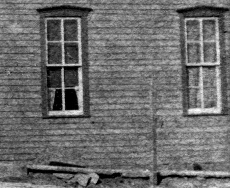 Lower floor side windows at right.